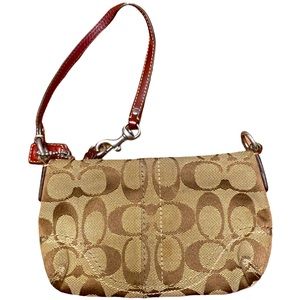 Coach Wristlet with Burgundy strap and tag
